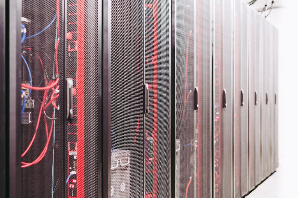 Modern data server room with network racks and cables.