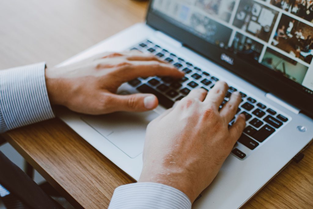 using laptop Employee working in Microsoft 365 on a laptop in an office